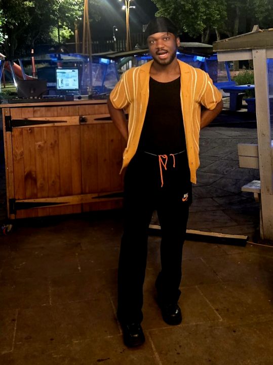 Man standing outdoors in Coventry during the evening