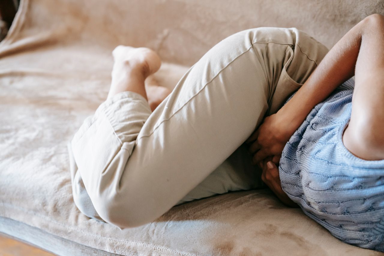 Person experiencing abdominal pain that may require medical assessment