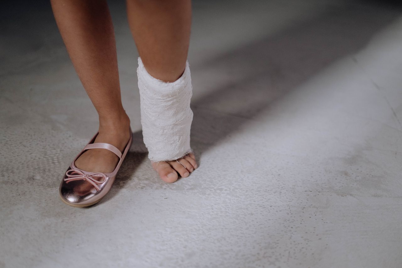 Person wearing a cast following a recent foot injury