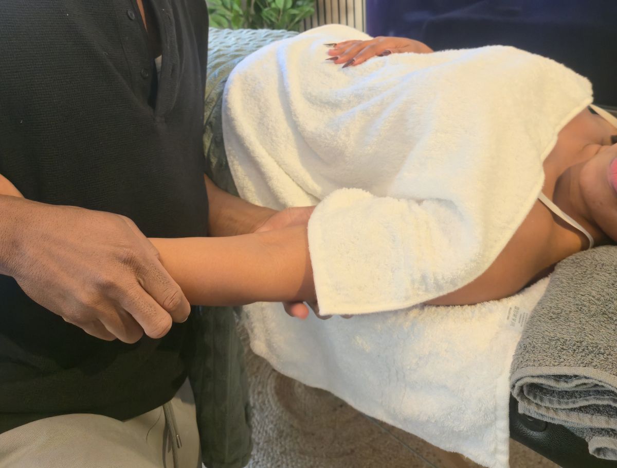 Client appropriately covered during a professional mobile massage treatment